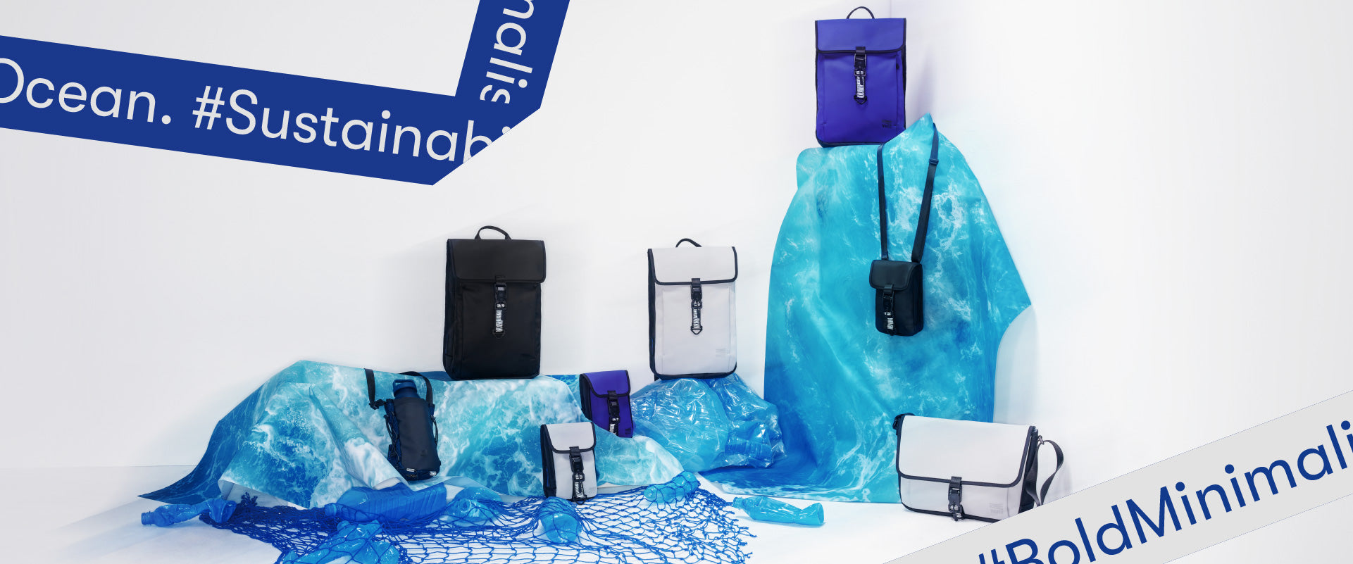 Banner for WAVEIT’s SEA SPARKLE series, featuring a range of sustainable bags made from ocean materials, displayed on blue fabric with hashtags #Sustainable and #BoldMinimalism.