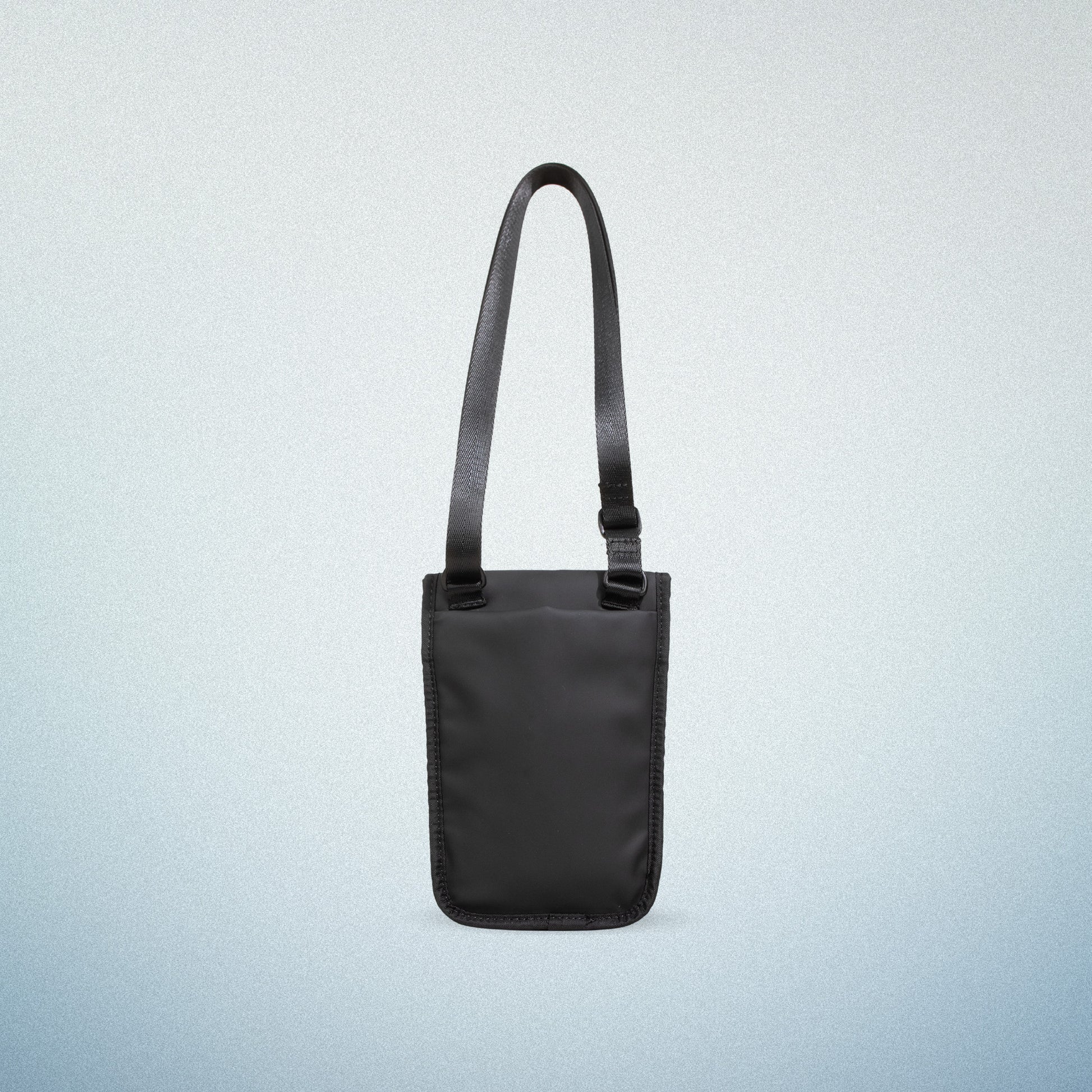 Back view of a black WAVEIT eco-friendly crossbody bag displayed on a light blue gradient background.