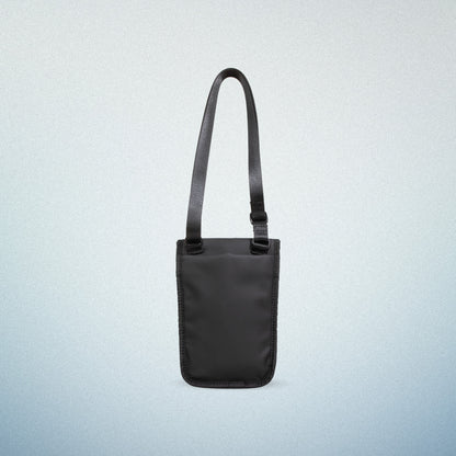 Back view of a black WAVEIT eco-friendly crossbody bag displayed on a light blue gradient background.