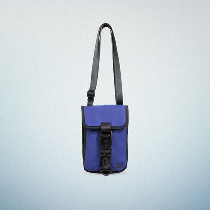 Front view of WAVEIT blue eco-friendly crossbody bag with adjustable strap and buckle closure.