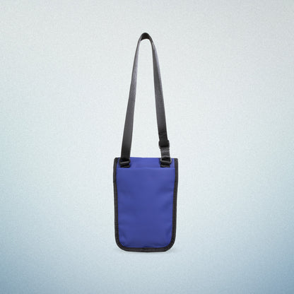 Back view of WAVEIT blue eco-friendly crossbody bag with adjustable strap, showcasing a minimalist and sustainable design.