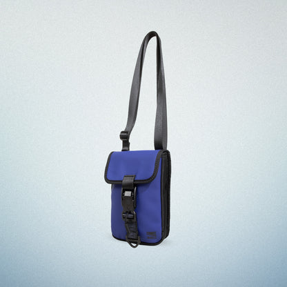 WAVEIT blue eco-friendly crossbody bag with secure buckle and adjustable strap, showcasing a stylish and sustainable design.